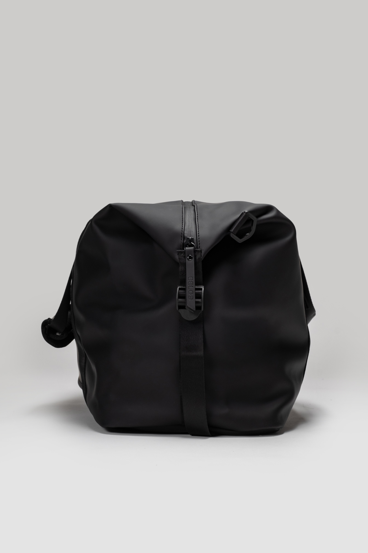 Black backpack on a light gray background