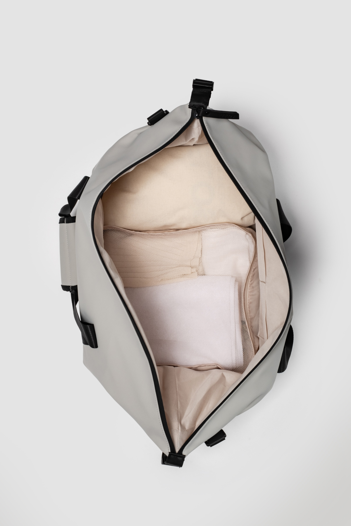 Gray backpack with beige interior on a white background