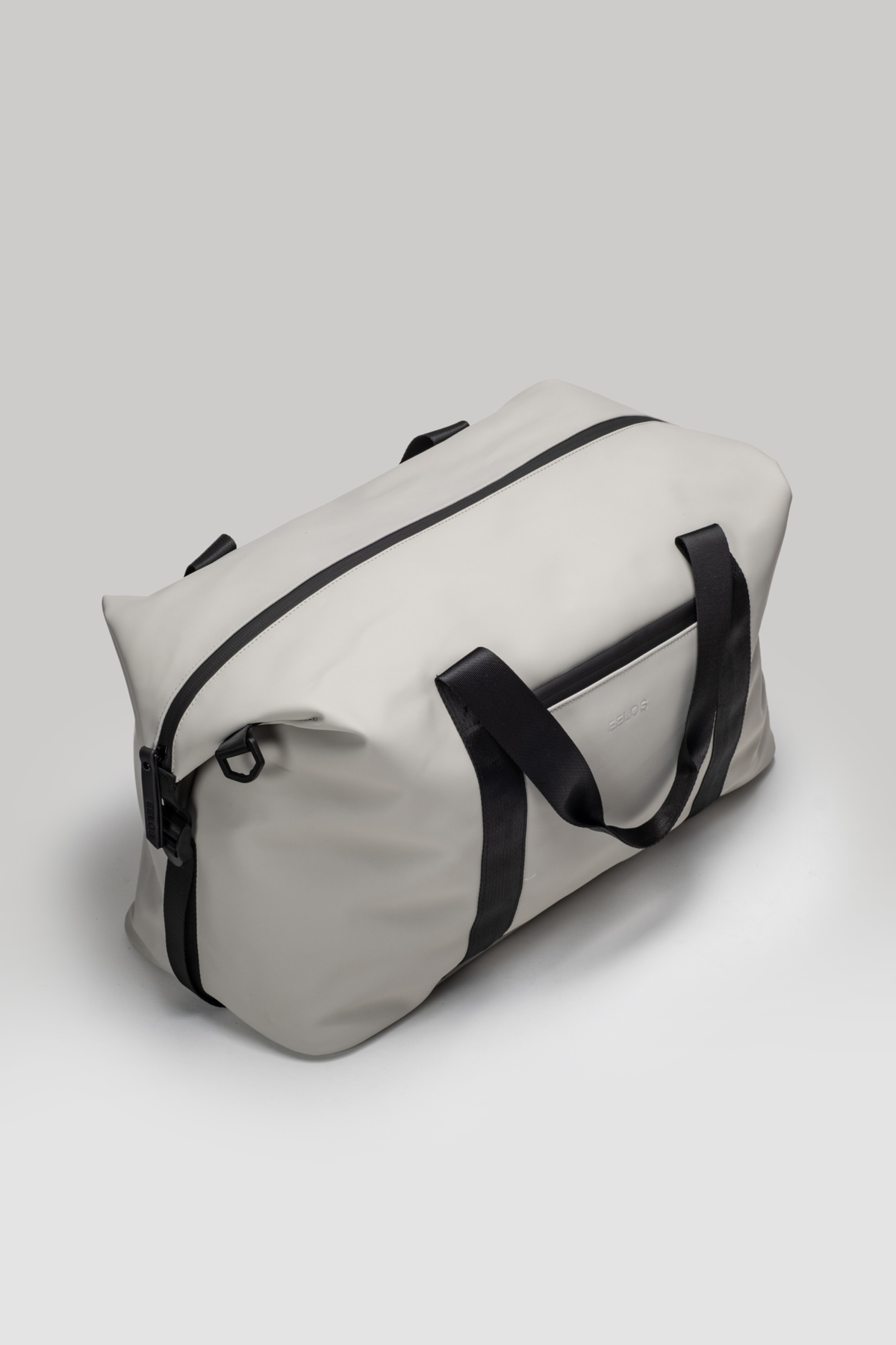 White duffel bag with black straps on a light gray background