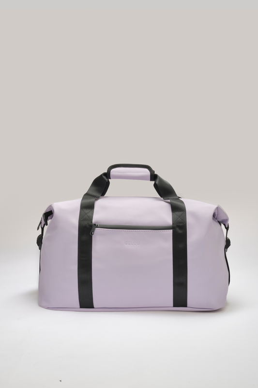 A light purple duffel bag with black handles and vertical straps, shown against a neutral light gray background.