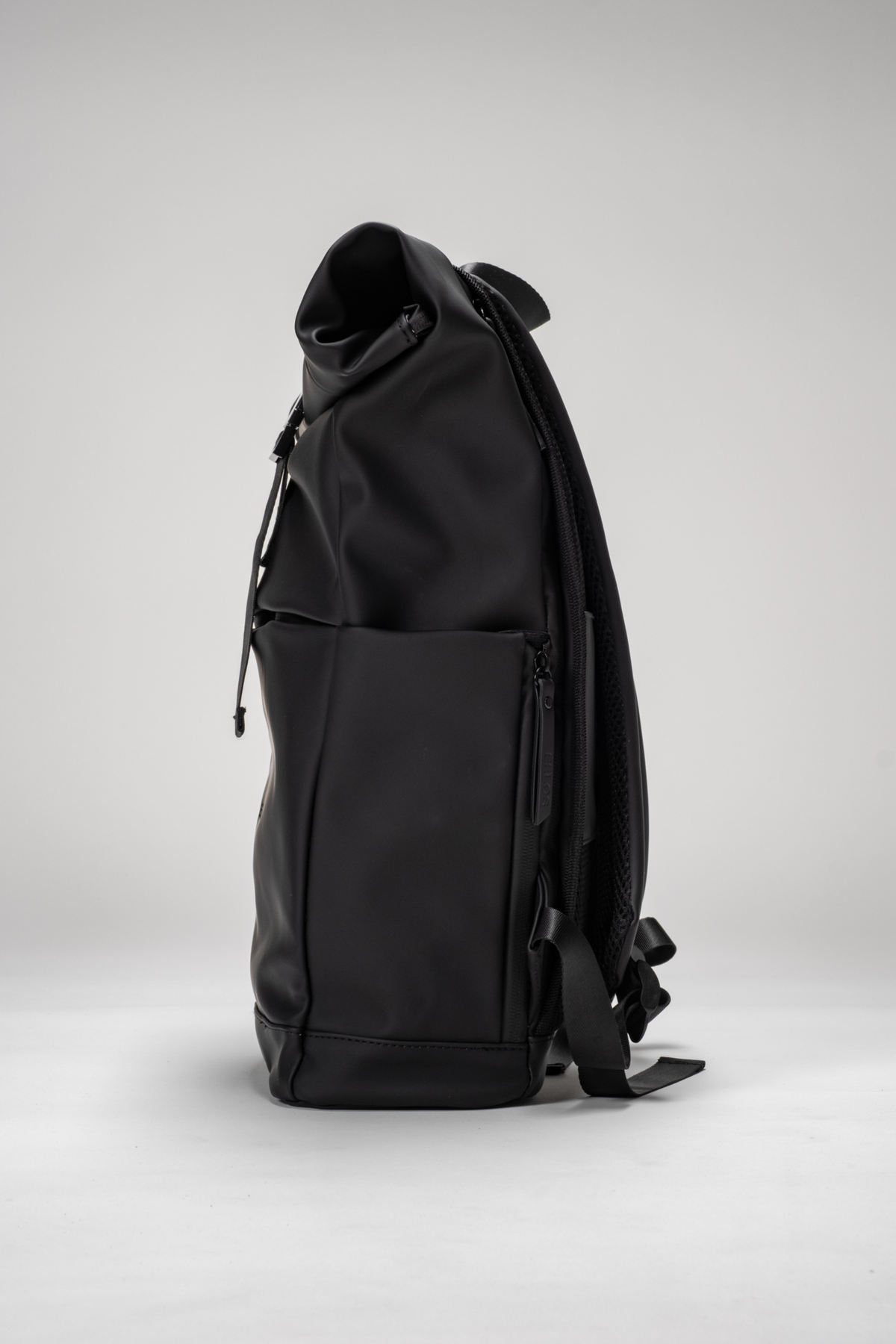 Black backpack on a light gray background