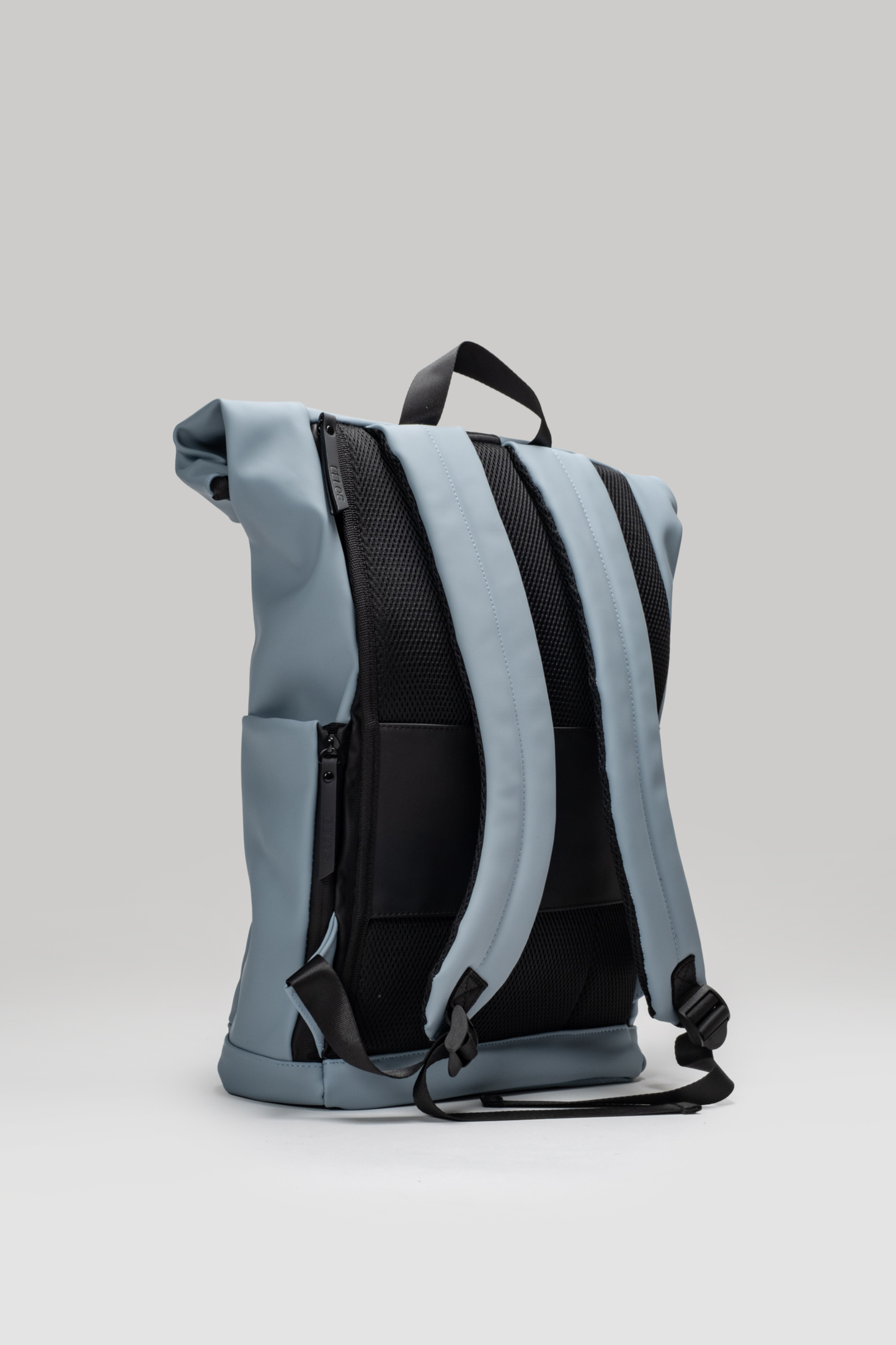 Gray and black backpack on a light gray background